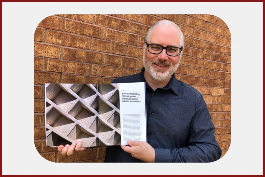 Daniel Butko displaying his past publication.