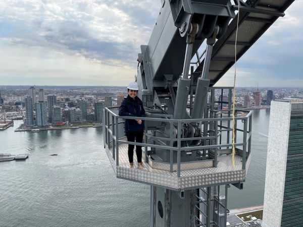 Esin Pektas at an elevated construction site.