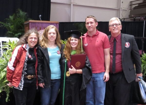 Hopper with his wife and kids at his daughter’s O U graduation.