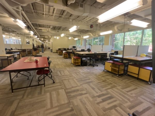 A studio space with desks and display boards.