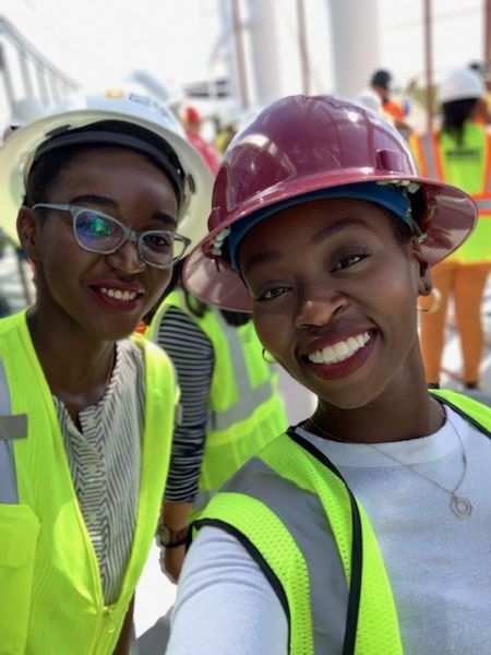 Grace Olaleye with a classmate at a construction site.