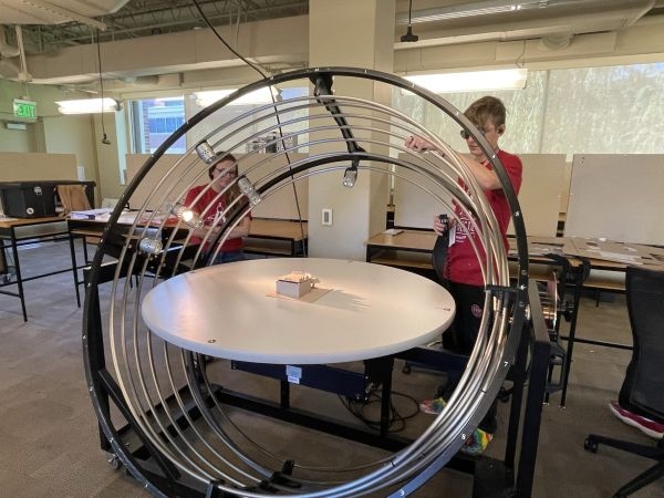 Students operating a heliodon.