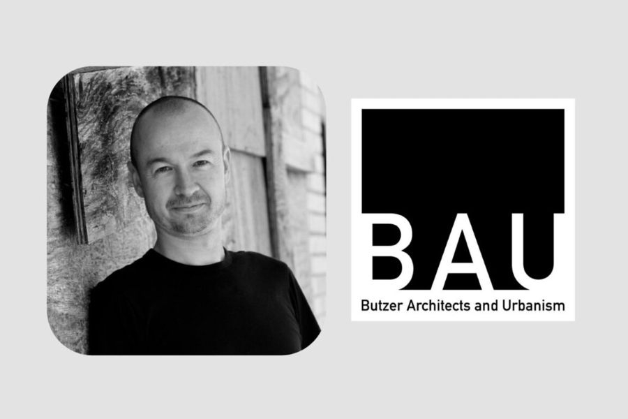 Hans Butzer with the logo for Butzer Architects and Urbanism.
