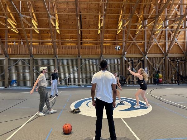 Students playing volleyball at the Thaden School gym.