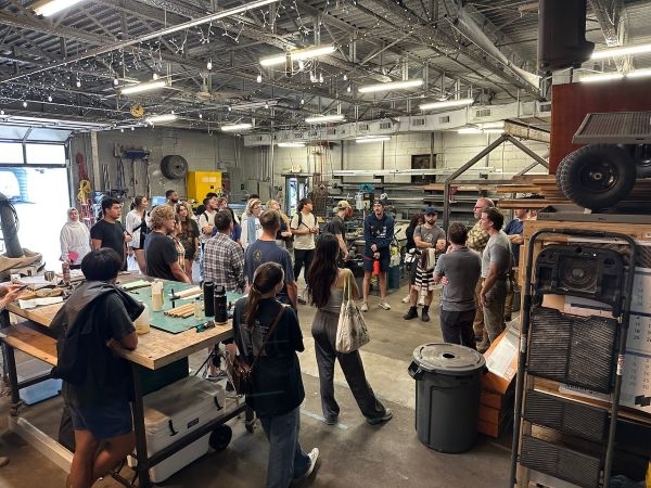 Students touring a workshop at Modus Studio.