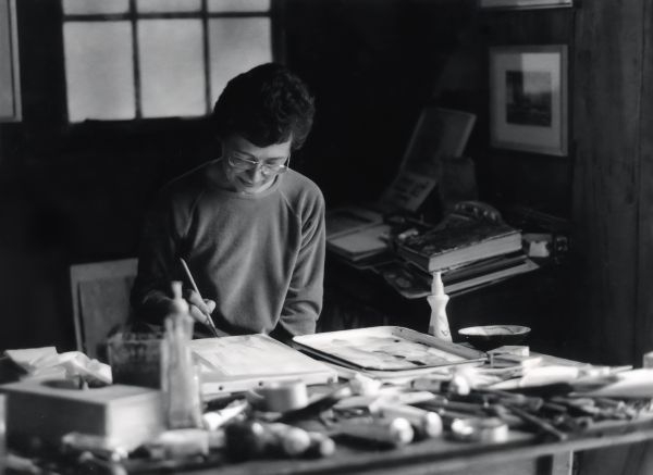 Pat Eidson working at a table.