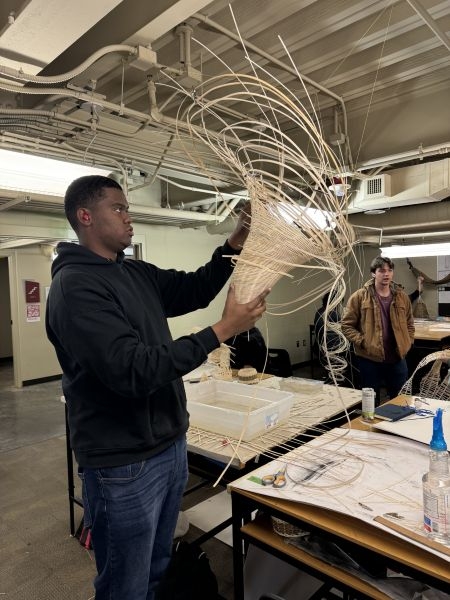 Student Braylyn Russel weaving a tornadic structure.