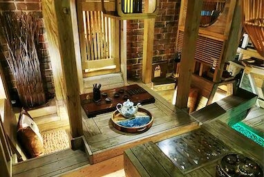 A table with tea set in Dreaming in the Lotus Bay.