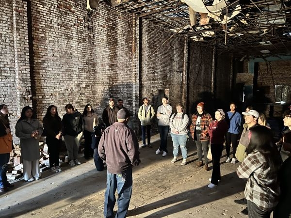 Arthur Hurst giving students a tour of the Jewel Theater.