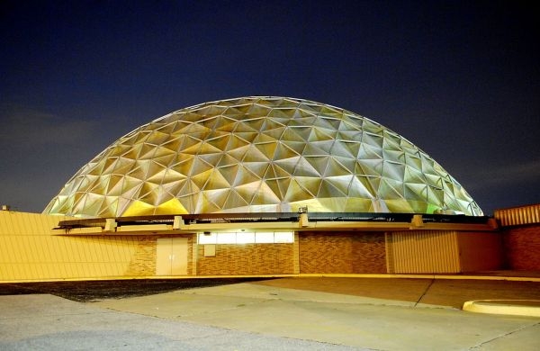 A building with a large gold faceted dome for a roof.