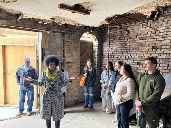 Karen Douglas giving students a tour of the Jewel Theater.