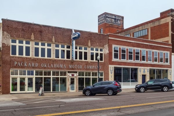 Brick buildings with old motor company signs.