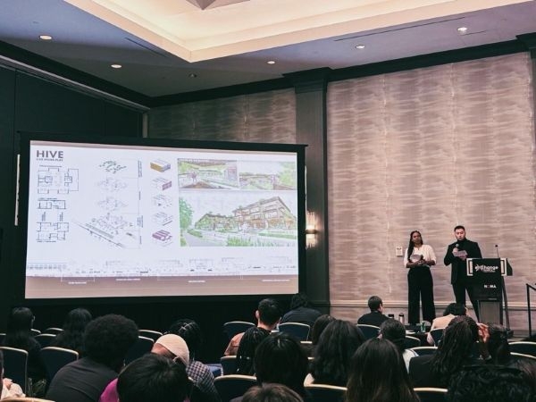The O U NOMAS team presenting their design solution.