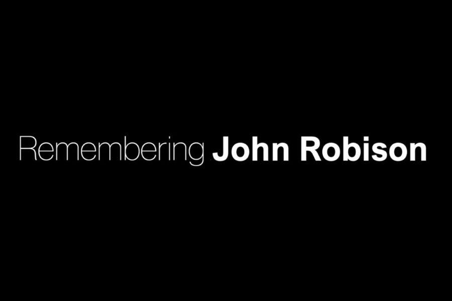 A black background with the text "Remembering John Robison".