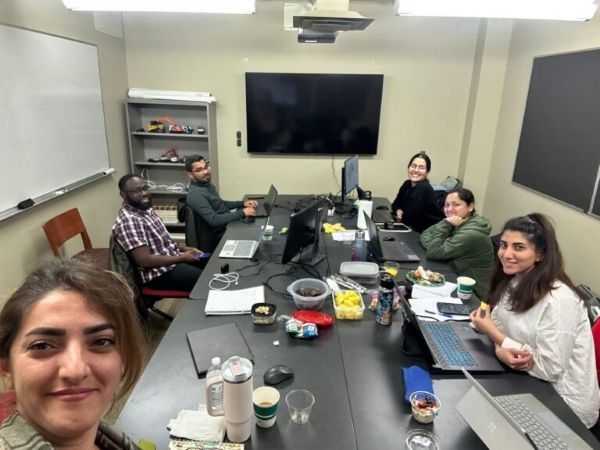 O U graduate students working on a competition proposal.