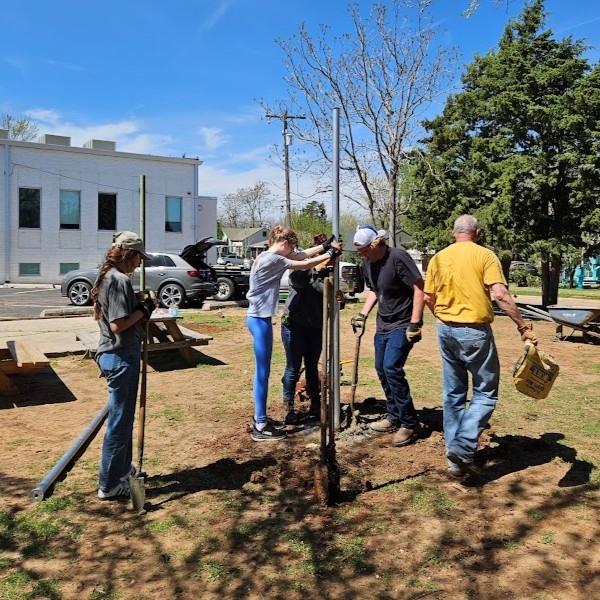 Students help build a shade pavilion.