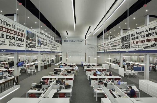 The Oklahoman newspaper bullpen with a timeline of notable headlines along the walls.