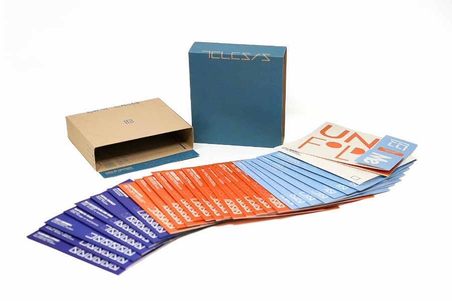 Telesis contents on a table including the cover and inserts. 