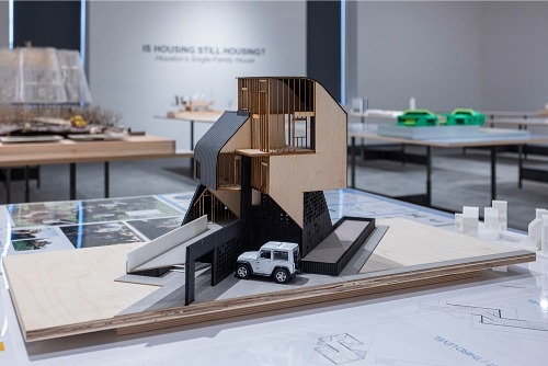 A single house model on a display at the Is Housing Still Housing exhibit. 