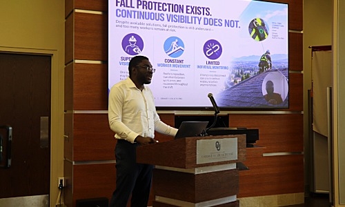 Chukwuma Nwokoye speaking at presentation. 