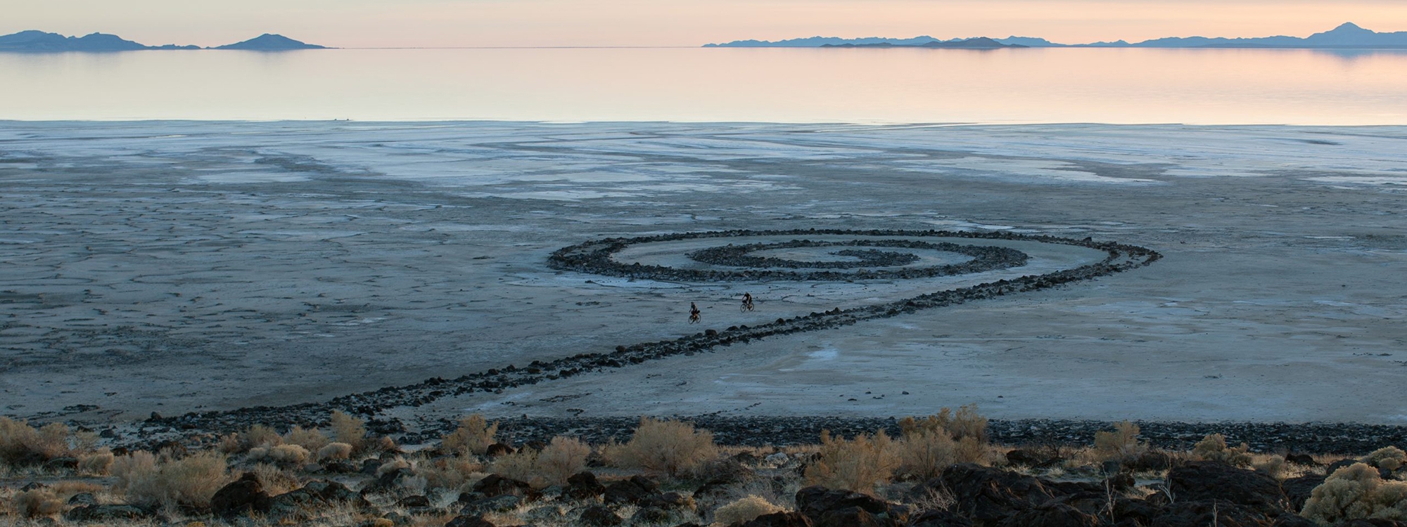 Bicyclists at Smithson’s Spiral Jetty by Todd Stewart, OU School of Visual Arts.