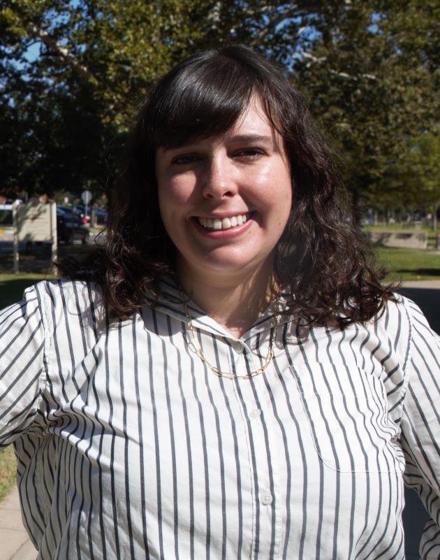 Front Office Coordinator Claire Miller in a white striped shirt