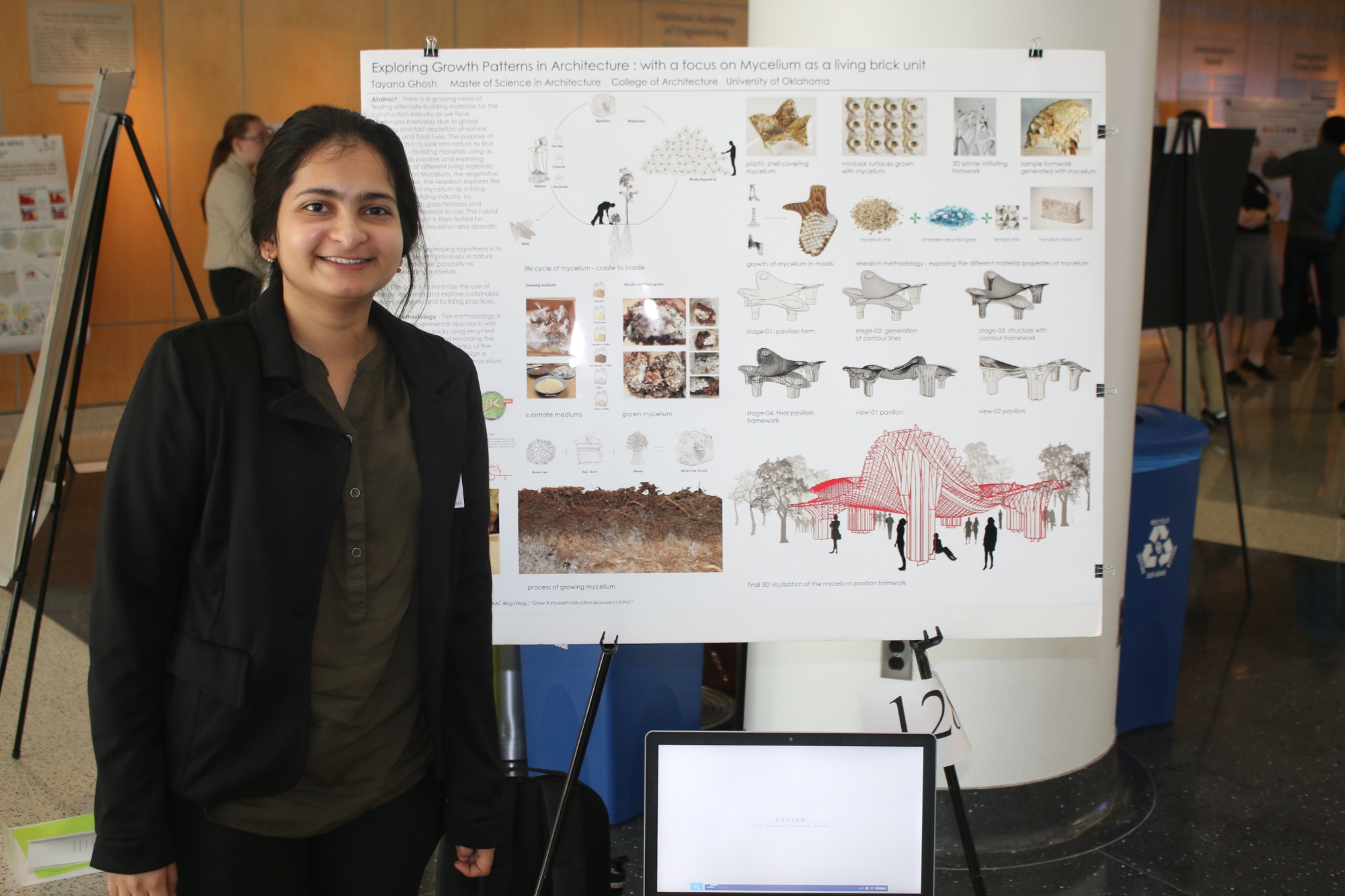 Student presenting research about architecture and mycellium.