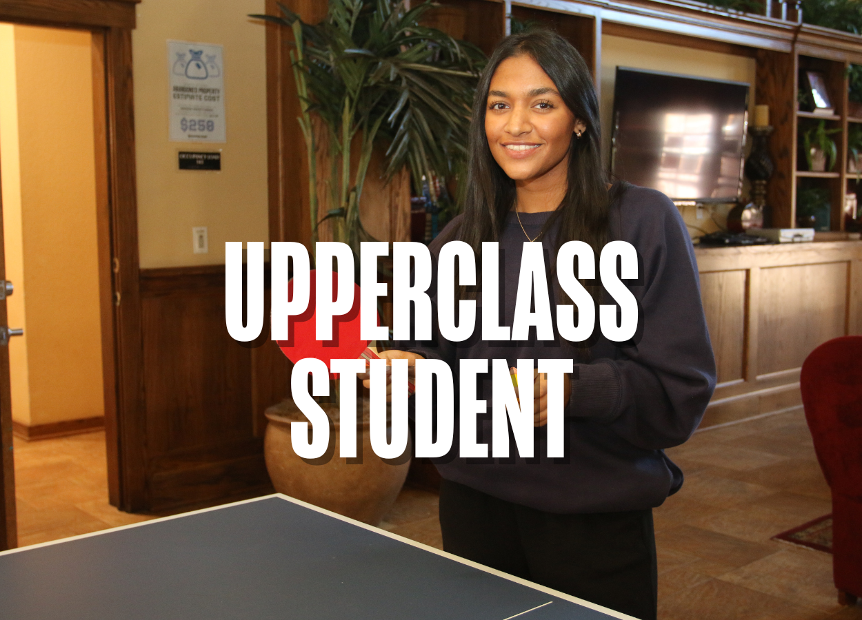 A group of students are visiting, reading, studying and playing games in the study lounge of the Residential Colleges