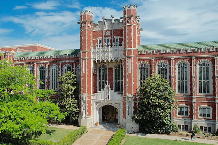 Evans Hall with a blue sky and clouds in the background.