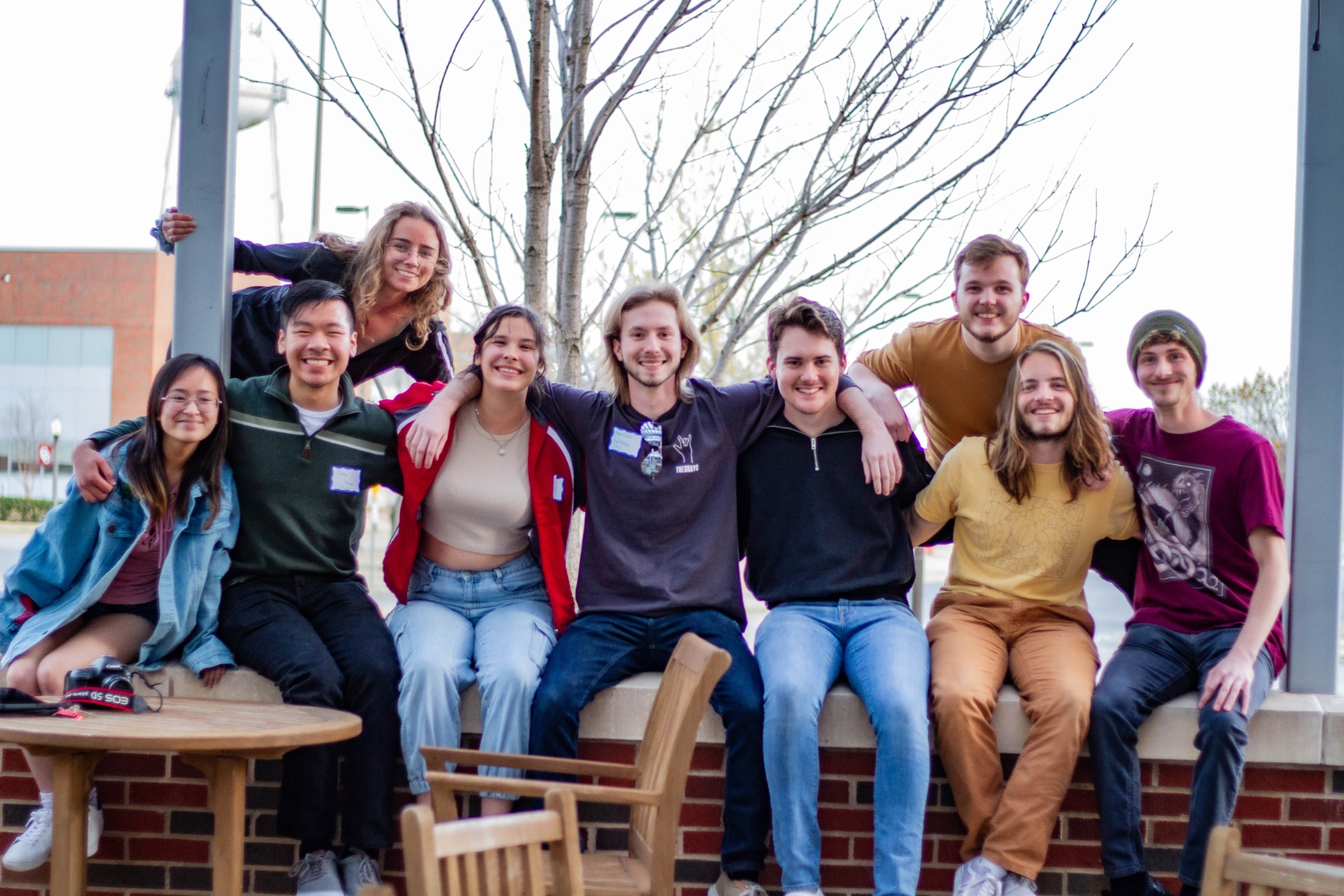 A group of students posing and smiling outside of the Innovation Hub