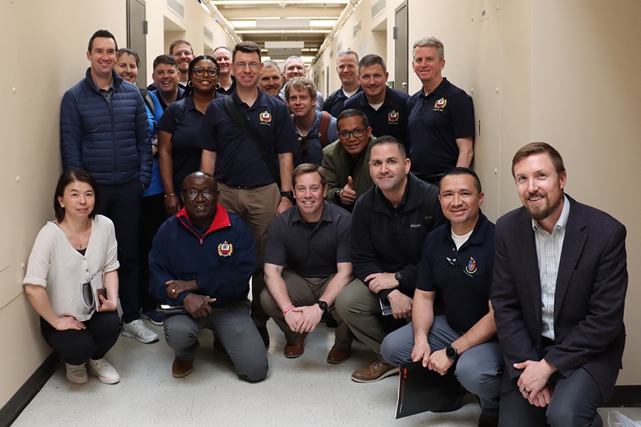 Steven Crossley, Ph.D., and Li Song, Ph.D., pose with NDU students after touring several labs in Sarkey’s Energy Center.