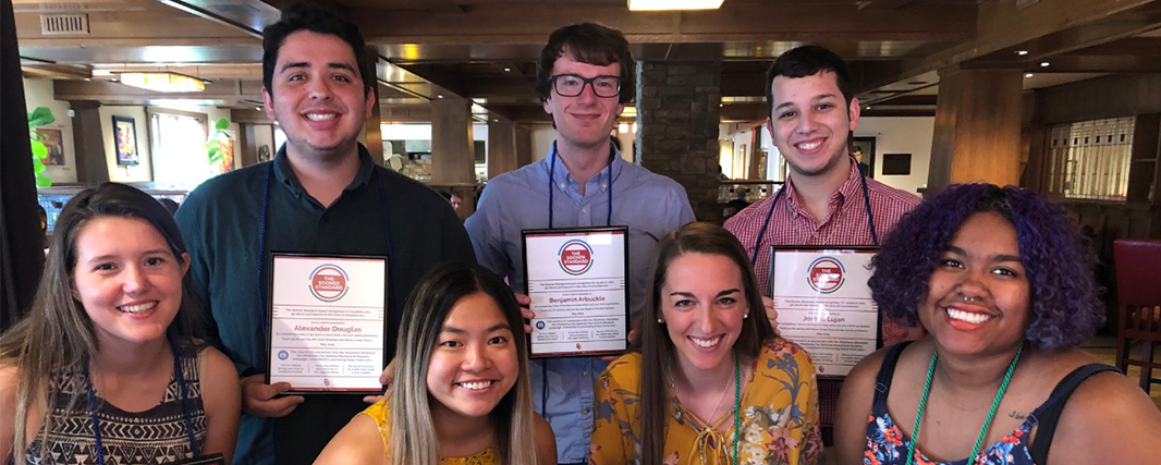 A group photo of Standard Award recipients holding their certificates.