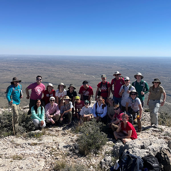 A group of students on top of a mountain.