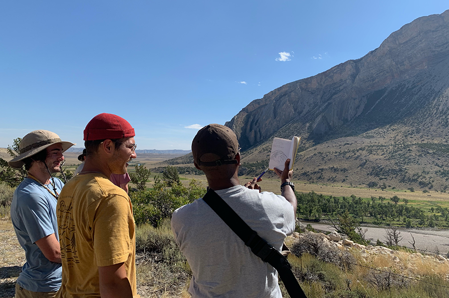 Students looking at sketch.