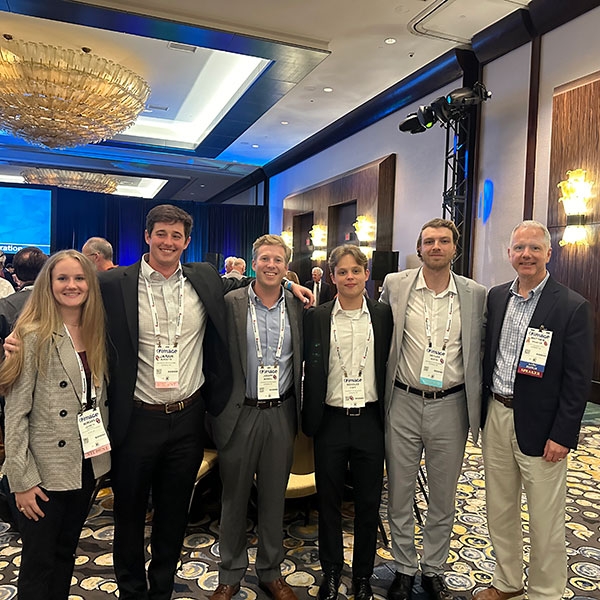 A group of students at a conference.