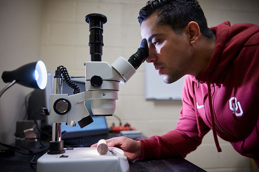 A student using a microscope.
