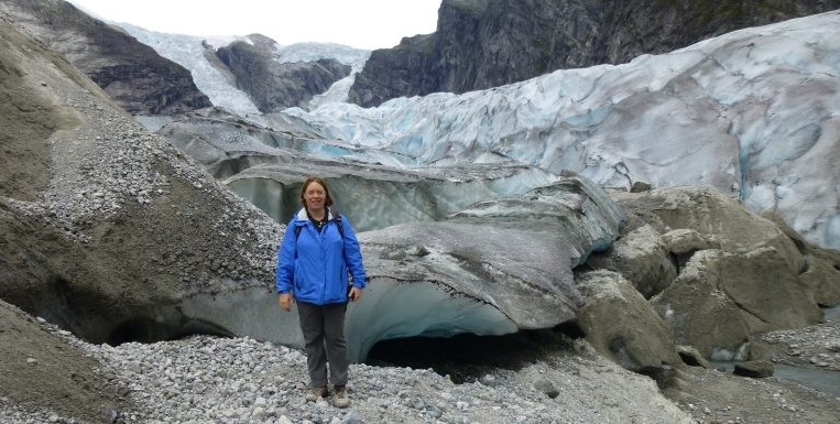 Dr. Elwood Madden in front of a glacier
