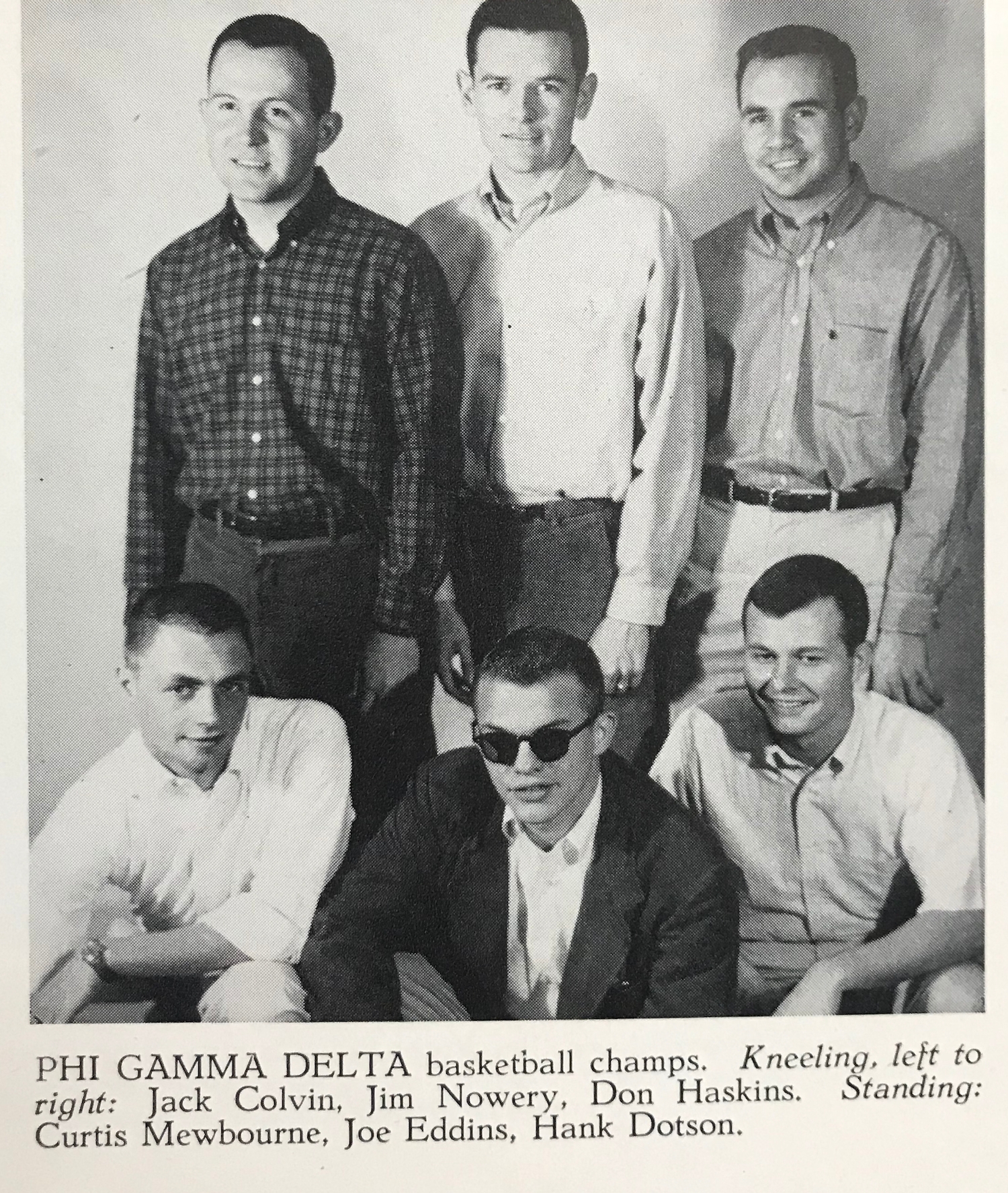 Curtis Mewbourne (standing on the left) posing with his fraternity’s championship basketball team.
