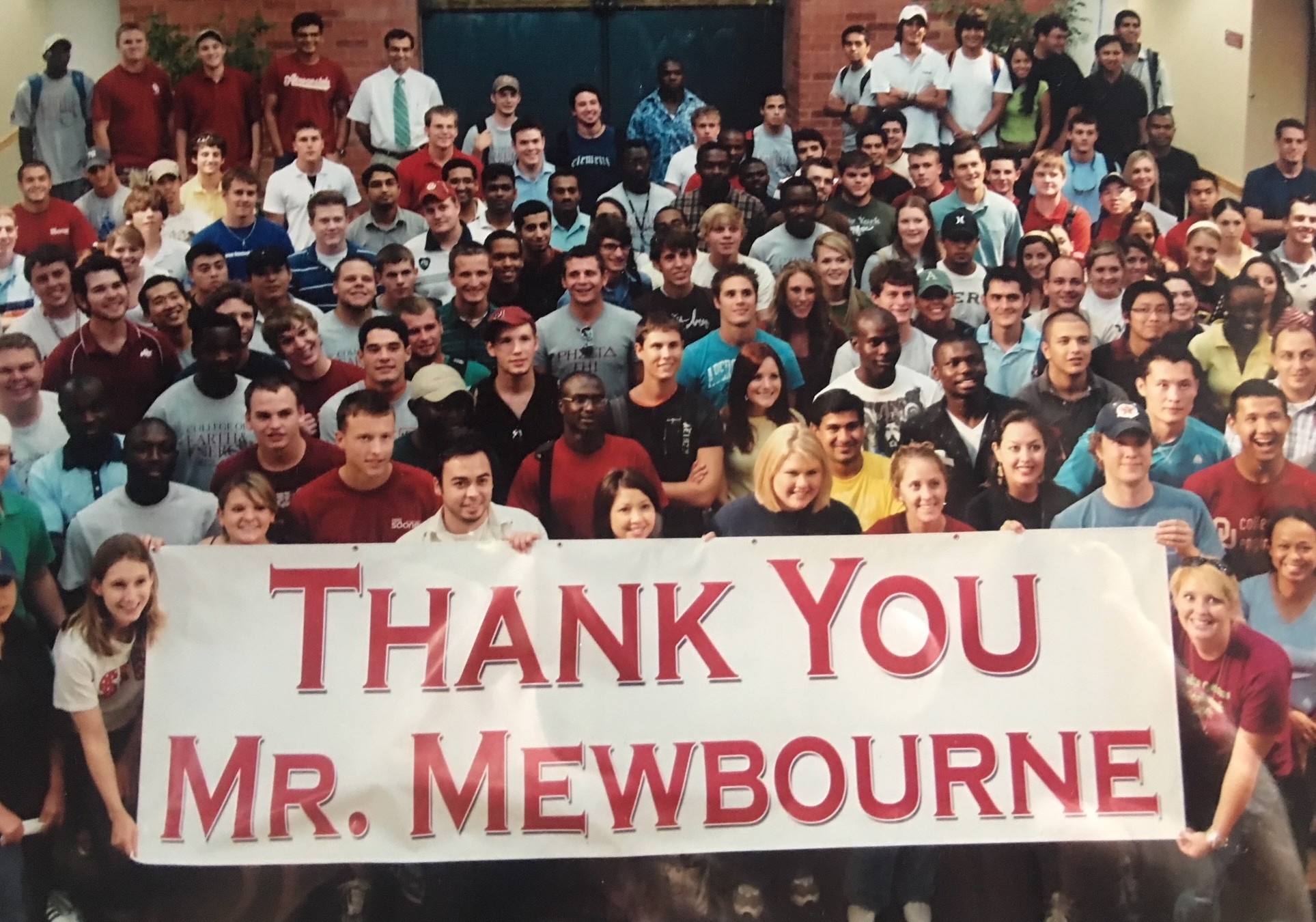 Society of Petroleum Engineers (SPE) students hold a banner thanking Mr. Mewbourne shortly after his naming gift for the Mewbourne School of Petroleum and Geological Engineering.