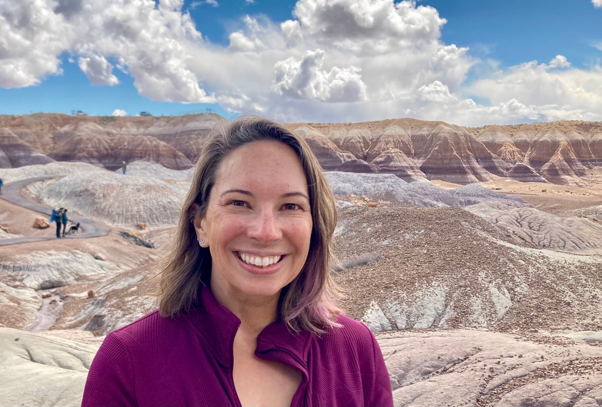Heather Bedle in front of a hilly landscape. 