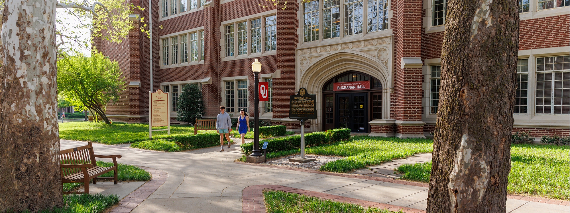 Two students walking outside Buchanan Hall.