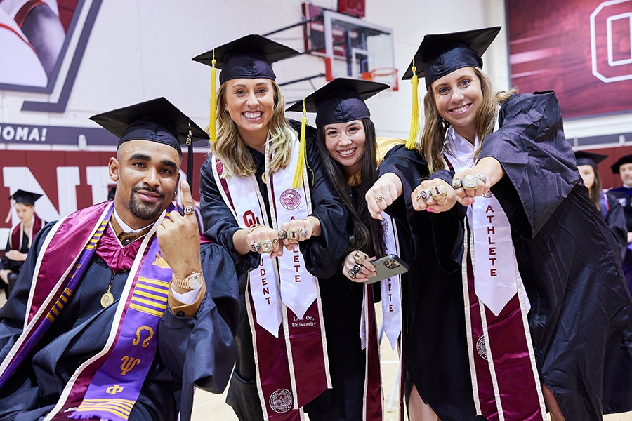 Jalen Hurts, former OU football player and current quarterback for the Philadelphia Eagles, and OU women’s gymnastics seniors Olivia Trautman, Jenna Dunn and Allie Stern.