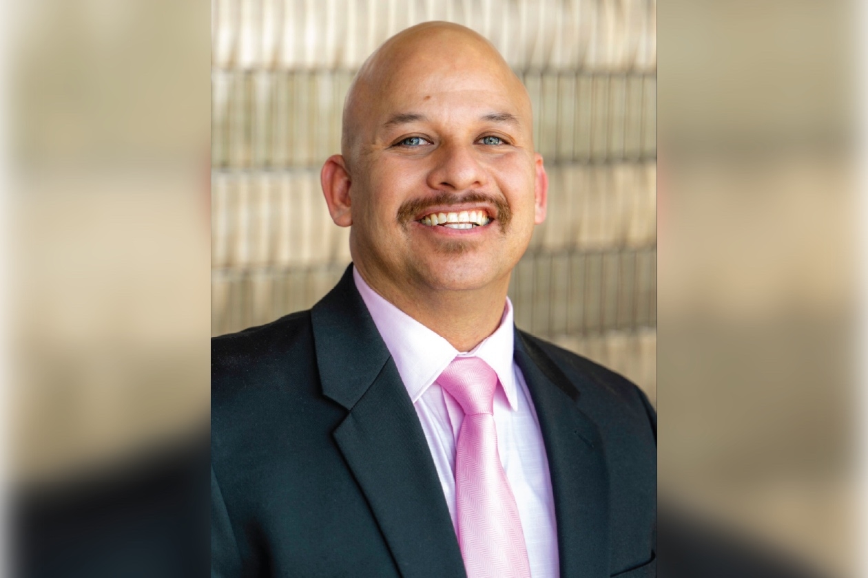 Juan Dills posing for a headshot.