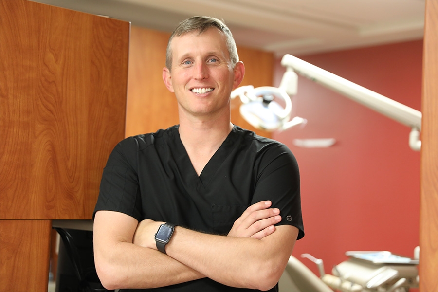 David Ciesla posing for a picture at his dentistry clinic.
