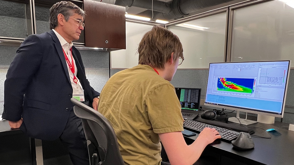 Bob Palmer works with a researcher to examine data from Horus.