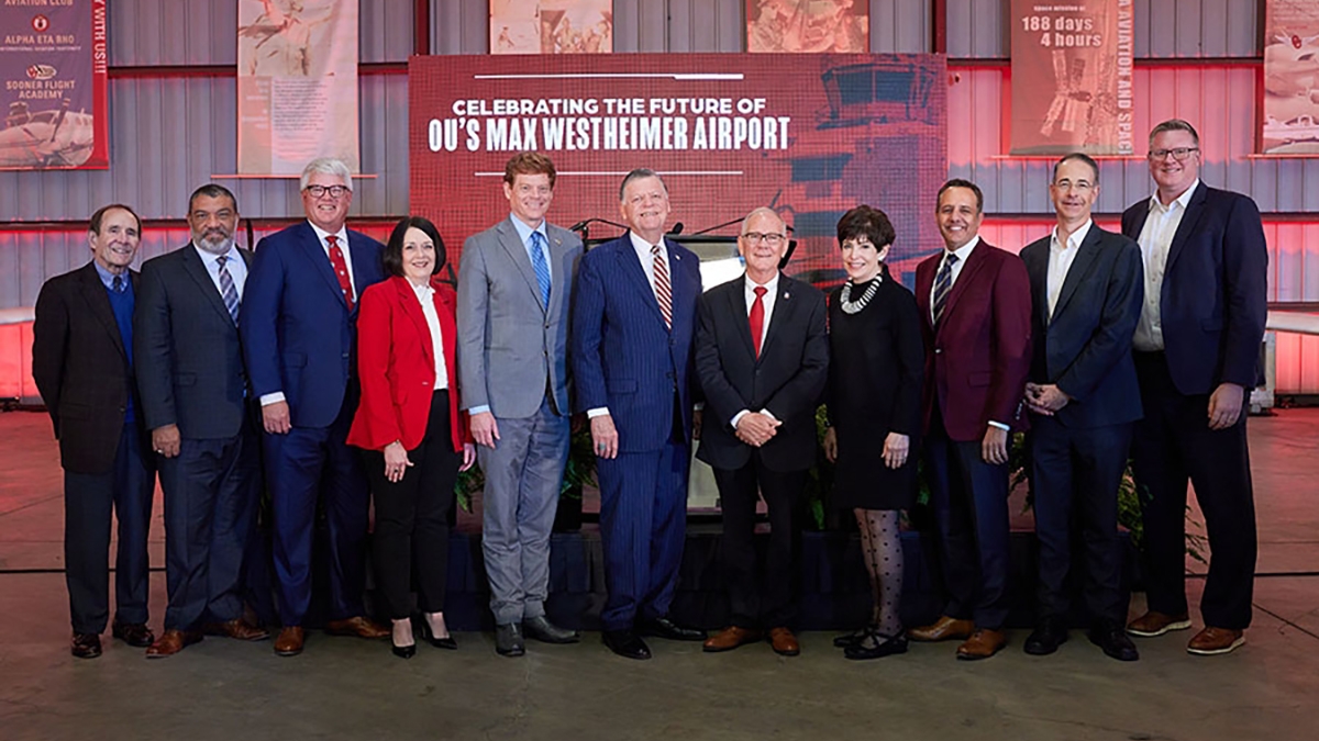 OU executives and regents pose during Aviation announcement.