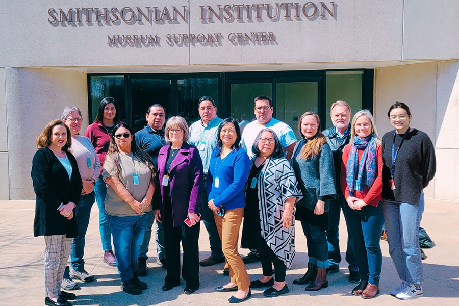 A group of people in front of the Smithsonian Institution.