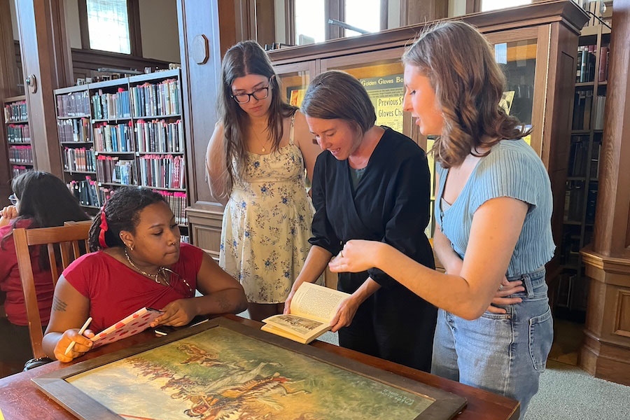 Students examining archival materials.