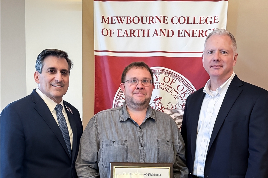 John Antoni, Brett Carpenter, and Matthew Pranter stand in front of a banner reading 'Mewbourne College of Earth and Energy.'