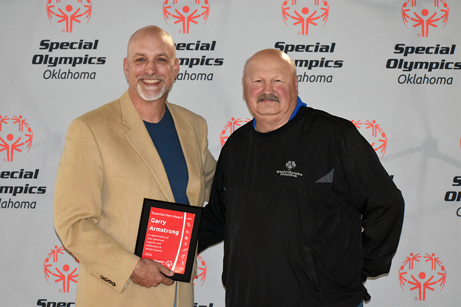 Garry Armstrong receiving his award.